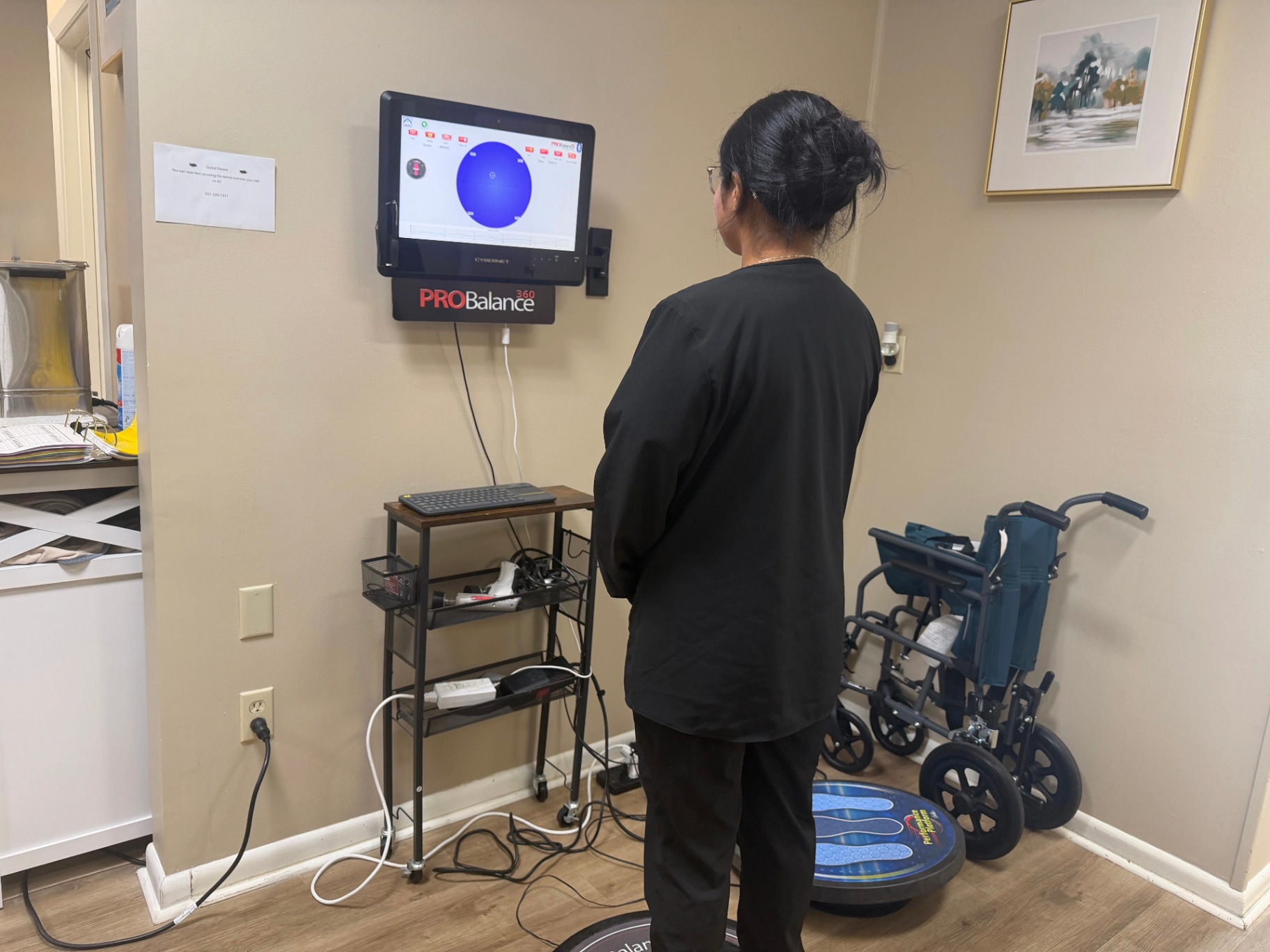 Patient using the ProBalance 360 balance-testing platform at Faulkenberry Chiropractic in Little Rock