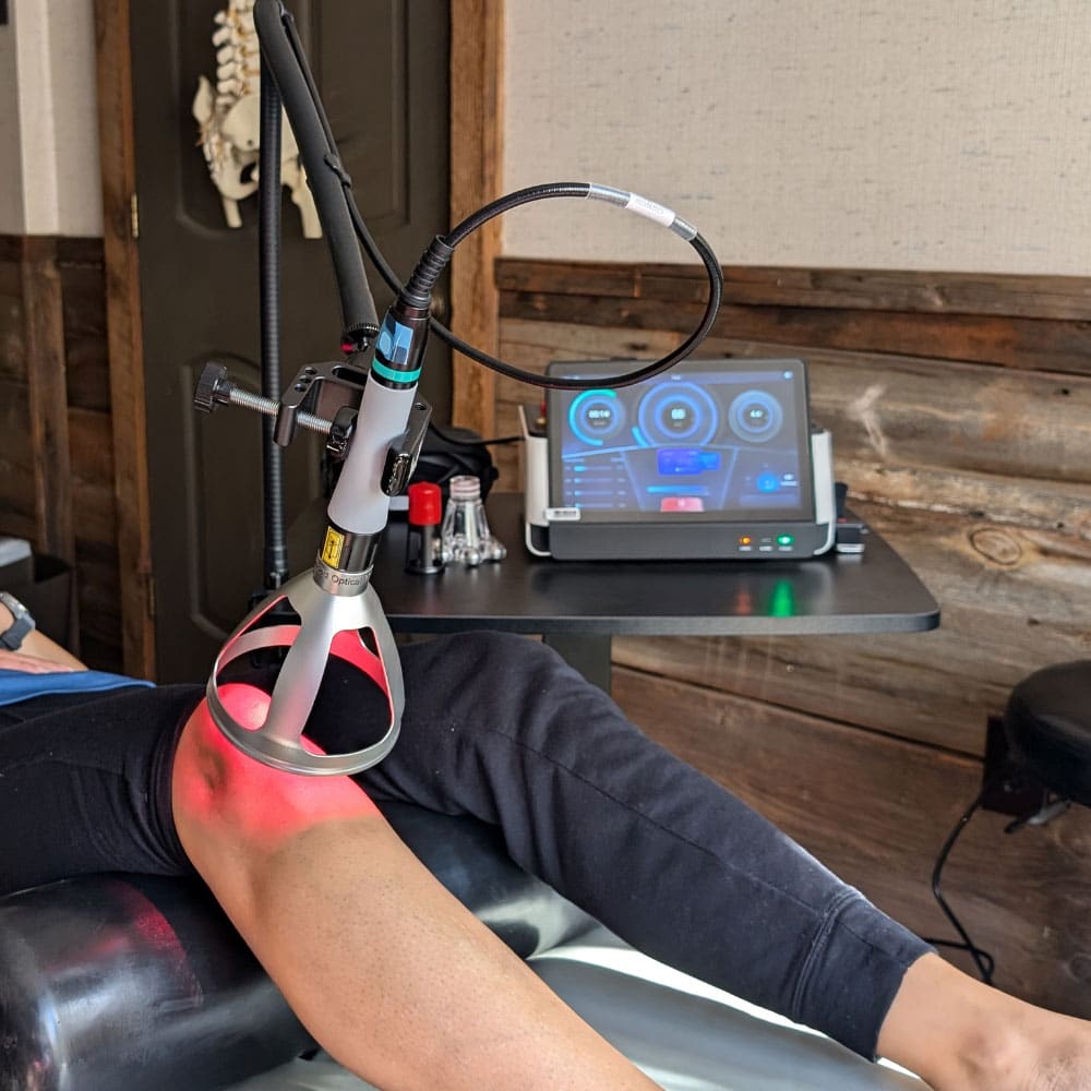 MedRay Class IV laser treating a patient's knee