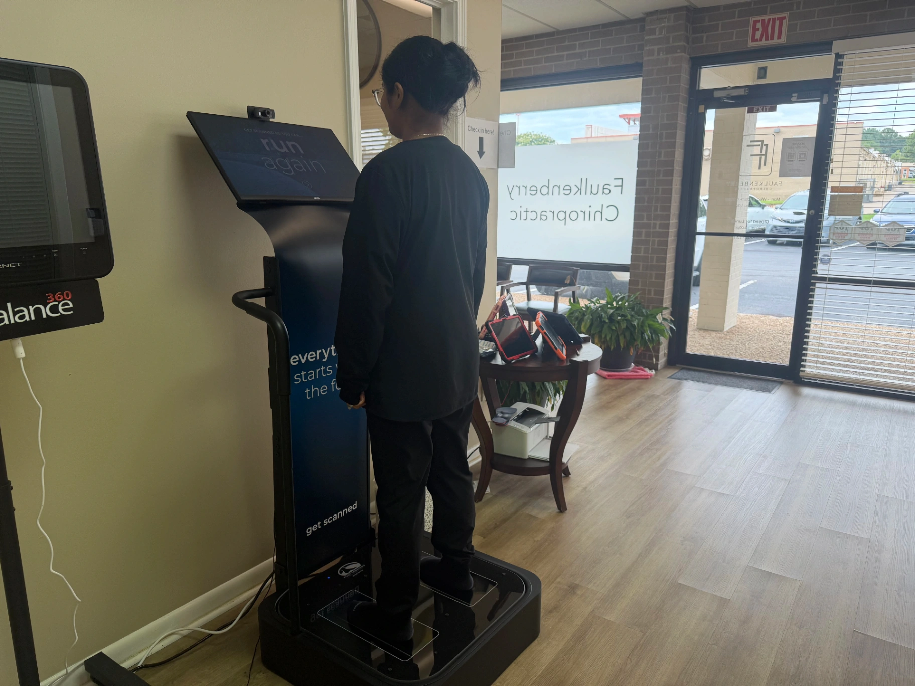 Patient being scanned on the Foot Levelers 3D BodyView scanner at Faulkenberry Chiropractic in Little Rock