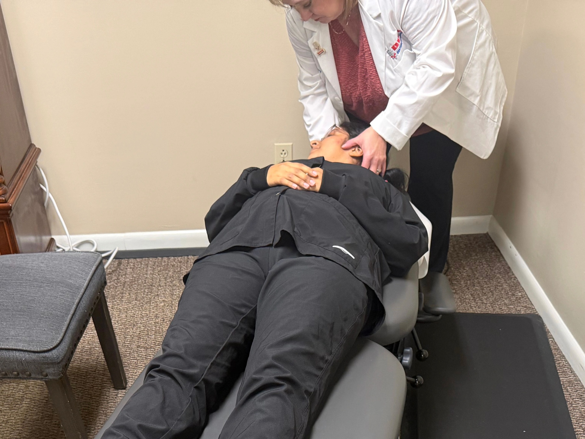 Dr. Faulkenberry performing the Epley maneuver on a patient at Faulkenberry Chiropractic in Little Rock