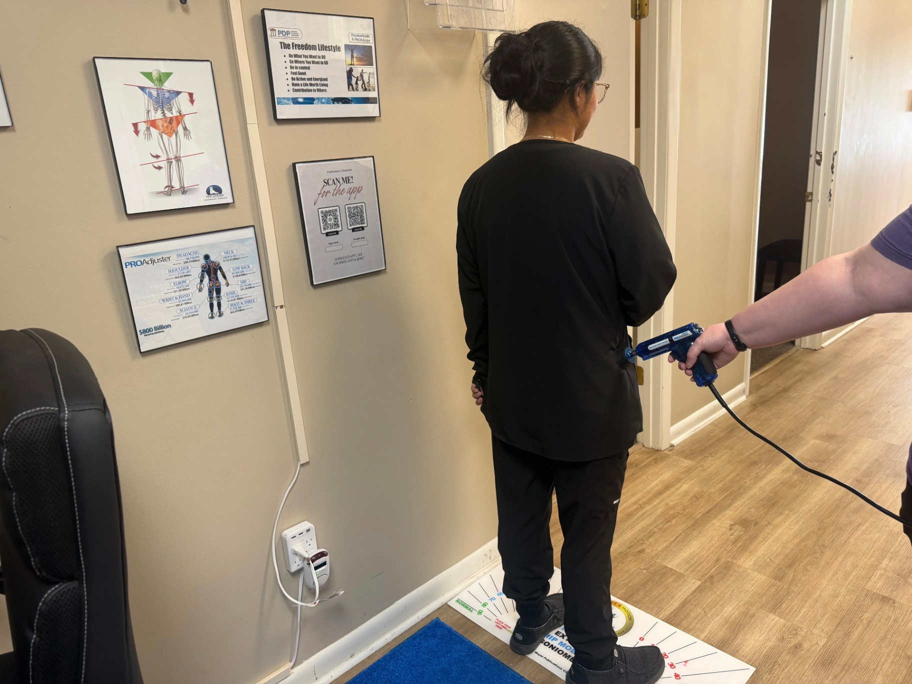 Patient receiving Mechanical Motion Therapy with the ProMotion instrument at Faulkenberry Chiropractic in Little Rock