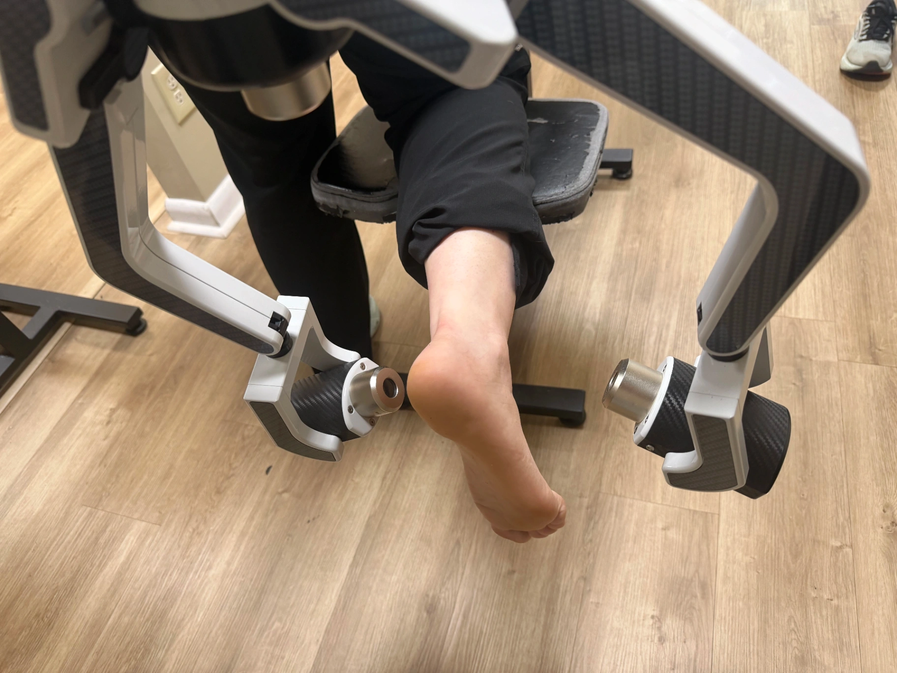 Cold laser therapy applied to a patient's foot at Faulkenberry Chiropractic in Little Rock